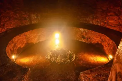 a fire pit with a candle in the middle at Hotel Juayua in Juayúa