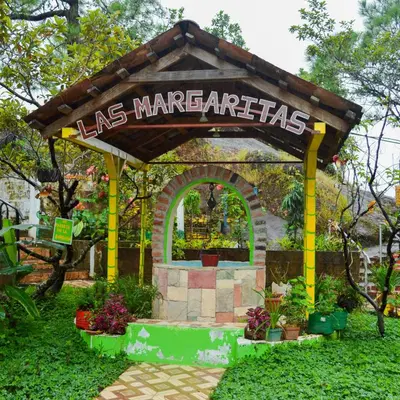 a gazebo with a sign that readslas maragogiates at Hotel y Restaurante Las Margaritas in Perquín