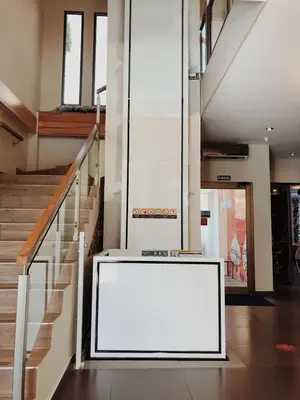 a large white sign in a hallway with stairs at Remfort Hotel in Santa Ana