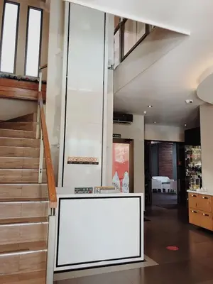 a large white board in a room with stairs at Remfort Hotel in Santa Ana
