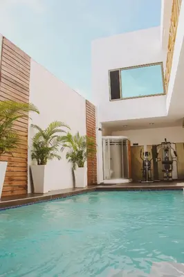a swimming pool in the middle of a building at Remfort Hotel in Santa Ana
