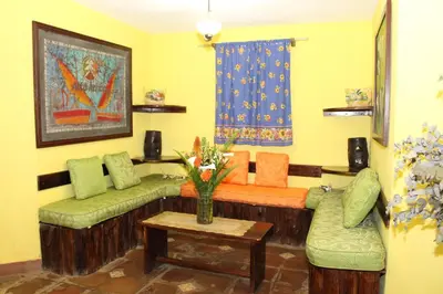a living room with two couches and a table at Alla Arriba in Las Cruces