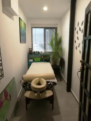 a bedroom with a bed sitting on a table in a room at Hotel Boutique Valverde Santa Elena in San Salvador