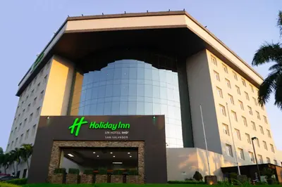 a building with a hilton tumkur hotel at Holiday Inn San Salvador by IHG in San Salvador