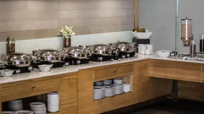 a kitchen with several pots and pans on a counter at Holiday Inn San Salvador by IHG in San Salvador