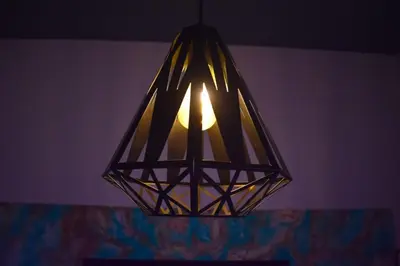 a lamp hanging from the ceiling in a room at Hostal Sole in Santa Ana