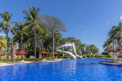 a slide in a pool at a resort at Royal Decameron Salinitas - All Inclusive in Los Cóbanos