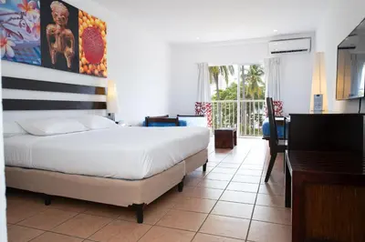 a bedroom with a bed and a table and a desk at Royal Decameron Salinitas - All Inclusive in Los Cóbanos