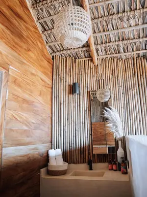 a bathroom with a shower with a sink and a mirror at Mizata By Antiresort in Santa María Mizata
