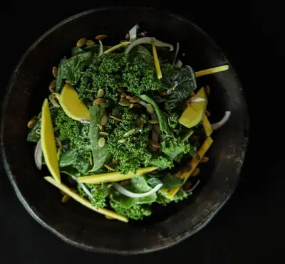 a bowl of food with broccoli and other vegetables at Mizata By Antiresort in Santa María Mizata