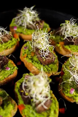 a group of small food items with cheese on top at Mizata By Antiresort in Santa María Mizata