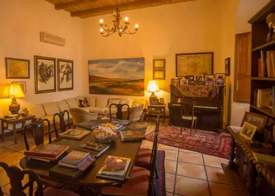 a living room with a table and a couch at Los Almendros de San Lorenzo in Suchitoto