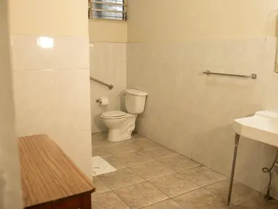 a bathroom with a toilet and a sink at Eco Hotel Mariscal in San Salvador