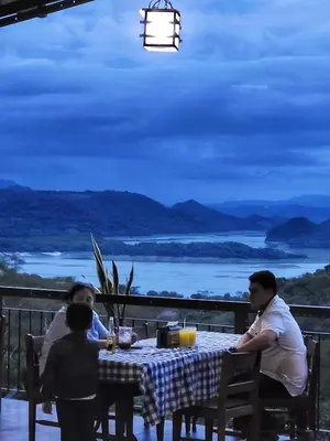 a group of people sitting at a table with a view at El Tejado in Suchitoto