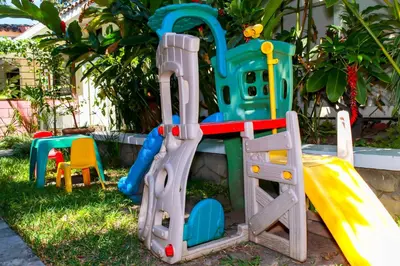 a set of playground equipment in a yard at Las Magnolias Hotel Boutique in San Salvador