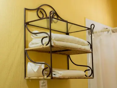 a towel rack with towels on it in a bathroom at Hotel Villa Terra in San Salvador