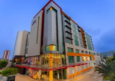 a tall building with graffiti on the side of it at Hyatt Centric San Salvador in San Salvador