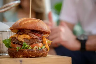 a sandwich sitting on top of a wooden table at Hyatt Centric San Salvador in San Salvador
