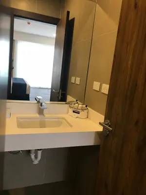 a bathroom with a sink and a mirror at Acantilados in La Libertad