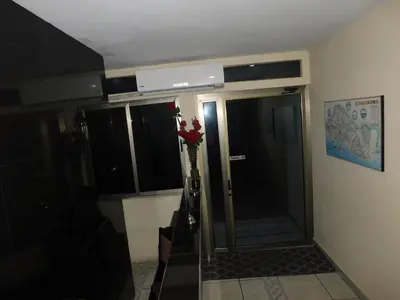 a bathroom with a shower with a glass door at Hotel San Jose Hostal in San Salvador