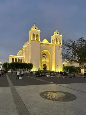a large white building with people walking in front of it at Zona Rosa San Benito 1 cuartito in San Salvador