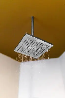 a shower head with water pouring out of it at Palo Verde Sustainable Hotel in El Zonte