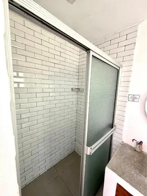 a shower with a glass door in a bathroom at Hotel Finca Campo Bello in Cerro Verde