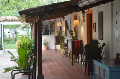 a room with a patio with potted plants at Hostal Koltin Suchitoto in Suchitoto