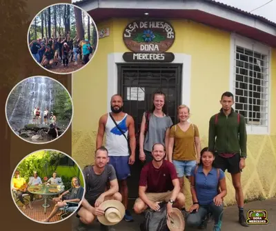 a group of people standing in front of a building at Hostal Doña Mercedes in Juayúa