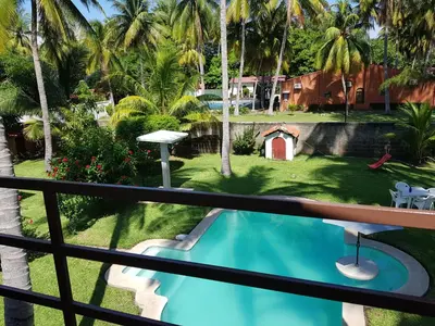a view from the balcony of a resort with a swimming pool at Rancho villas de alicia in La Paz