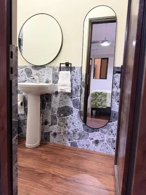 a bathroom with a sink and a mirror at Villa Las Flores in San Salvador