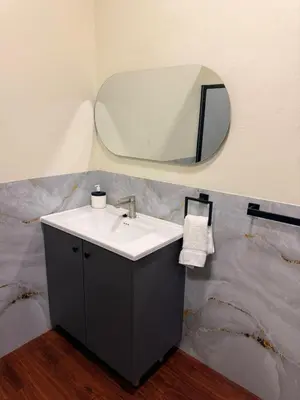 a bathroom with a sink and a mirror at Villa Las Flores in San Salvador