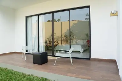 a room with a table and a chair on a balcony at Il Buongustaio in San Salvador