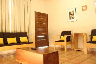 a living room with a couch and a coffee table at Hotel Bahia del Sol in La Herradura