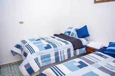 two beds sitting next to each other in a bedroom at Mixtepek in Juayúa