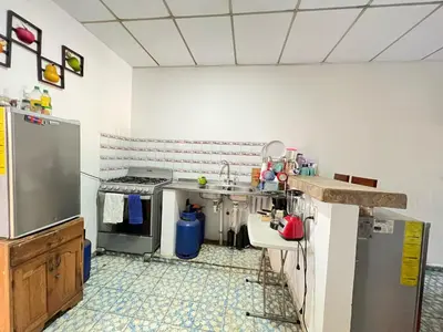 a kitchen with a sink and a stove at Mixtepek in Juayúa