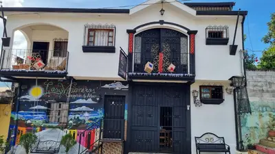 a house with a mural on the side of it at Hostal Las Veraneras Ataco in Concepción de Ataco
