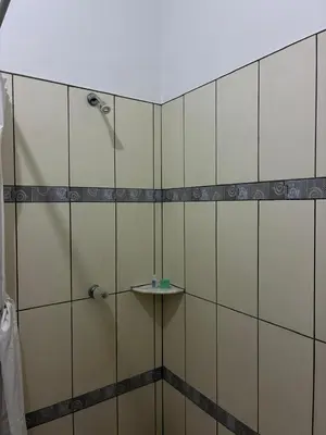 a bathroom with a shower and a sink at RodMar Hotel in El Cuco