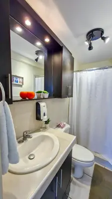 a bathroom with a sink and a toilet at Luxury Modrn Apartment, w/amazing view, 3BR,Escalon,Exclus,Secur in San Salvador