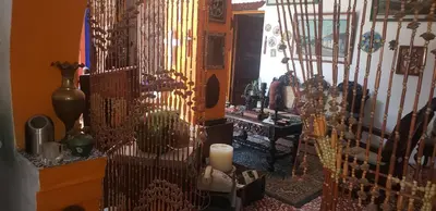 a room filled with lots of items on a wall at Mendoza’s Guest House in Santa Ana