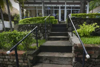 a set of stairs in front of a building at RocaSol Casa d´Mar in El Zonte