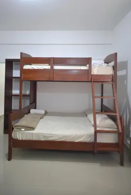 a set of bunk beds in a room at RocaSol Casa d´Mar in El Zonte