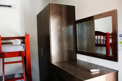 a bedroom with a mirror and a desk with a bunk bed at The Luxury Apartment in San Salvador
