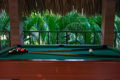 a pool table with cue balls on top of it at Hotel Martinez in Conchagüita