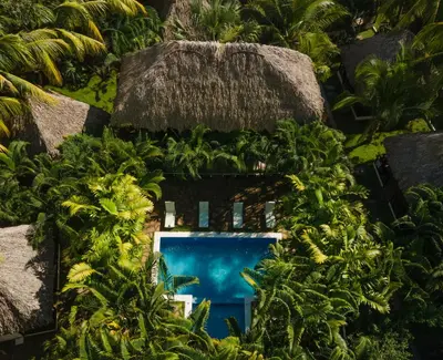 an overhead view of a resort with a swimming pool at Hotel Martinez in Conchagüita