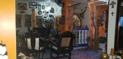 a room with a table and chairs in a room at Mendoza’s Guest House in Santa Ana