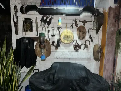 a wall with a bunch of items on it at Mendoza’s Guest House in Santa Ana
