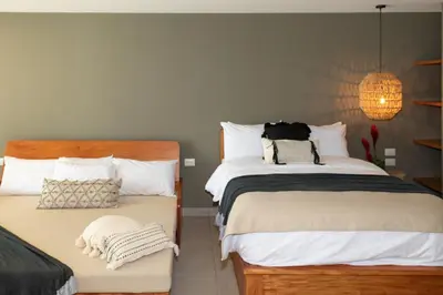 a bedroom with two beds next to each other at Fishermans Resort Life in La Libertad