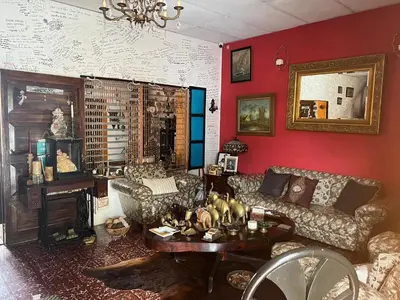 a living room with a couch and a table at Mendoza’s GUESTHOUSE in Santa Ana