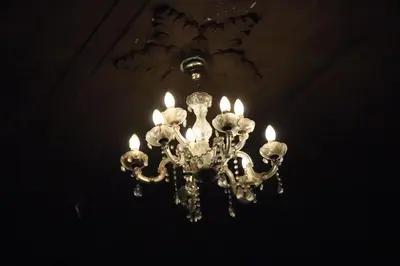 a chandelier hanging from a ceiling with lights at Hotel Brunette in Santa Ana